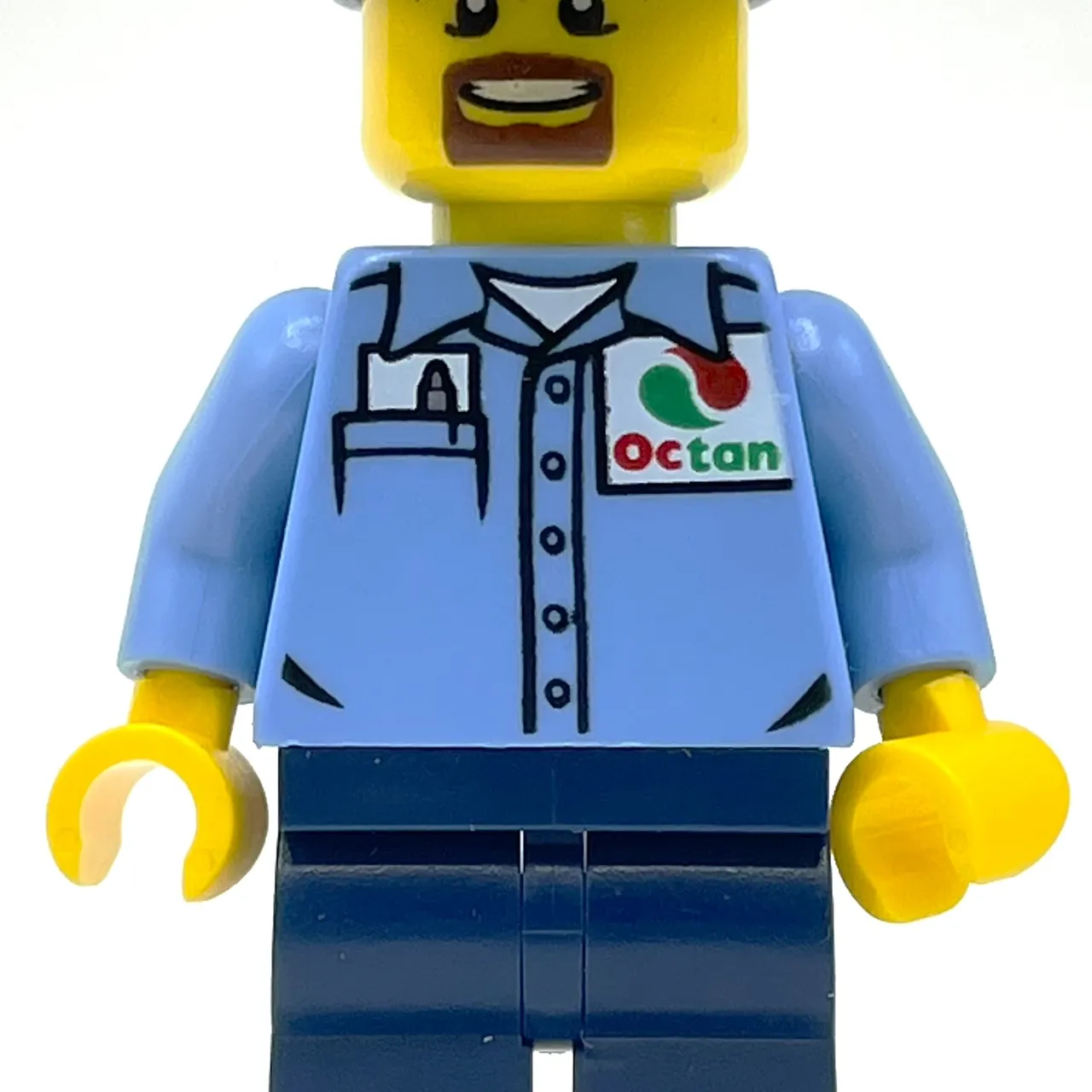 Man, Medium Blue Shirt with Octan Logo, Dark Blue Legs, Dark Blue Cap, Goatee Beard