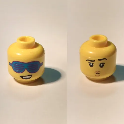 Minifig Head, Dual Sided, Lopsided Smile and Large Slotted Blue Sunglasses / Raised Eyebrow, and Small Pouting Mouth