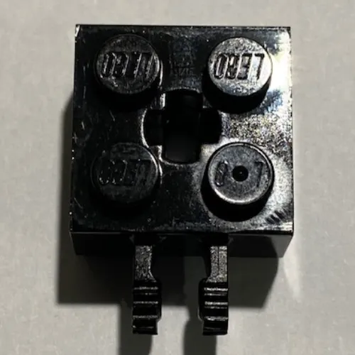 Hinge Brick 2 x 2 Locking with 2 Fingers Vertical and '+' Axle Hole, 9 Teeth