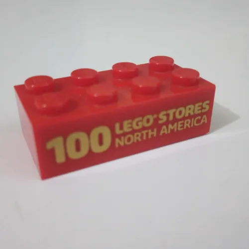 Brick 2 x 4 with '100 LEGO Stores North America' print