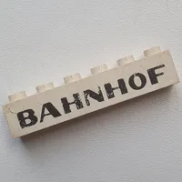 Brick 1 x 6 without Bottom Tubes with Cross Side Supports with 'BAHNHOF' Sans-Serif Black Print