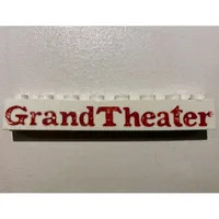Brick 1 x 8 without Bottom Tubes with Cross Side Supports with 'Grand Theater' Bold Red Print