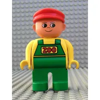 Duplo Figure, Early, with Flat Cap Red, Green Legs, Green Overalls with Red 'ZOO' Print