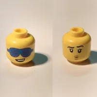 Minifig Head, Dual Sided, Lopsided Smile and Large Slotted Blue Sunglasses / Raised Eyebrow, and Small Pouting Mouth