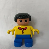 Duplo Figure, Early Child, with Straight Hair Black, Blue Legs, Yellow Top with Collar and 2 Buttons Print